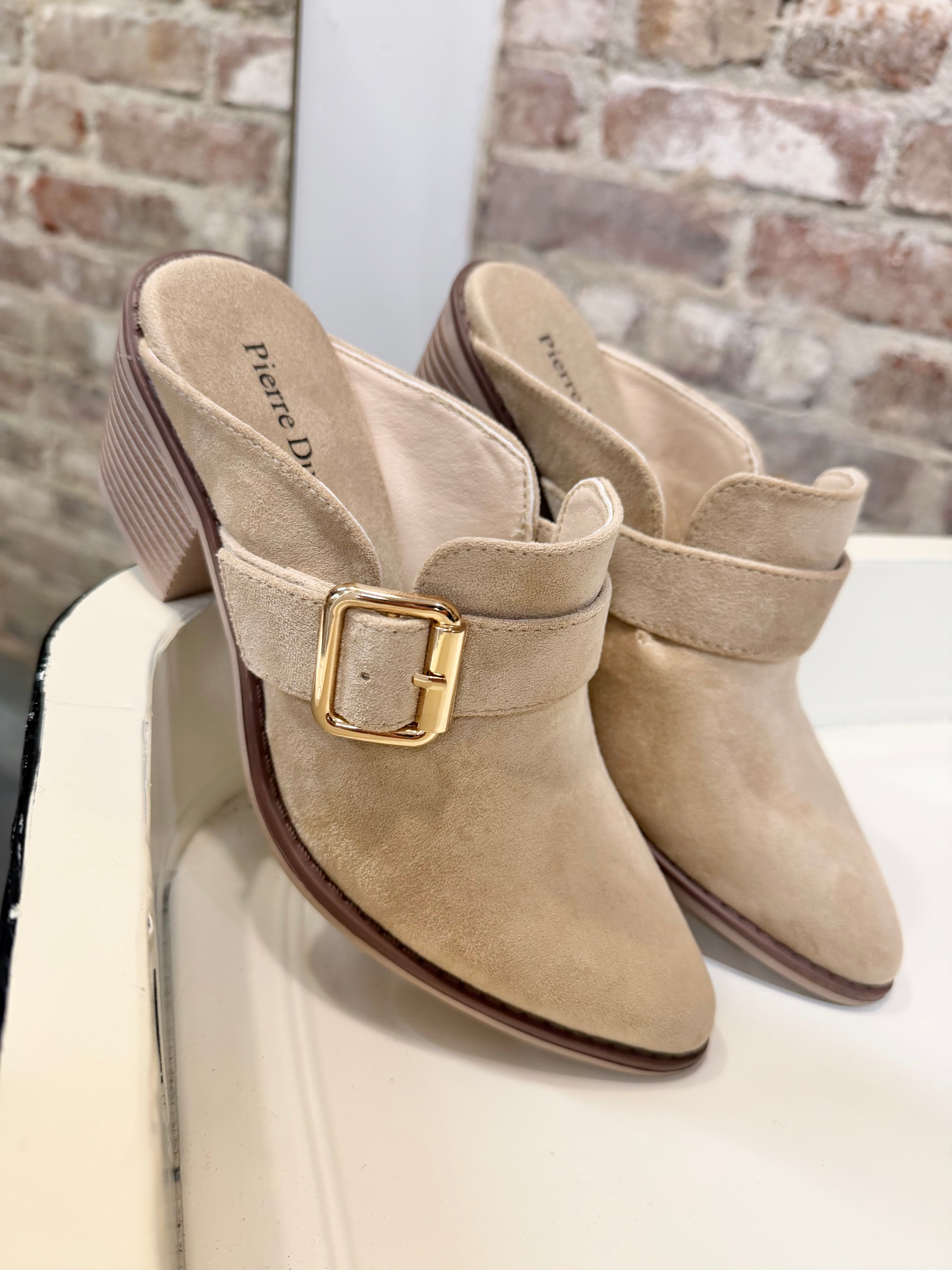 Pierre Dumas Christy Mule in taupe suede with gold square buckle detail and block heel.