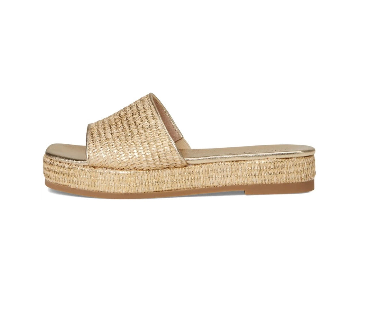 Gold raffia platform slide sandal with woven strap and espadrille-style flatform sole.