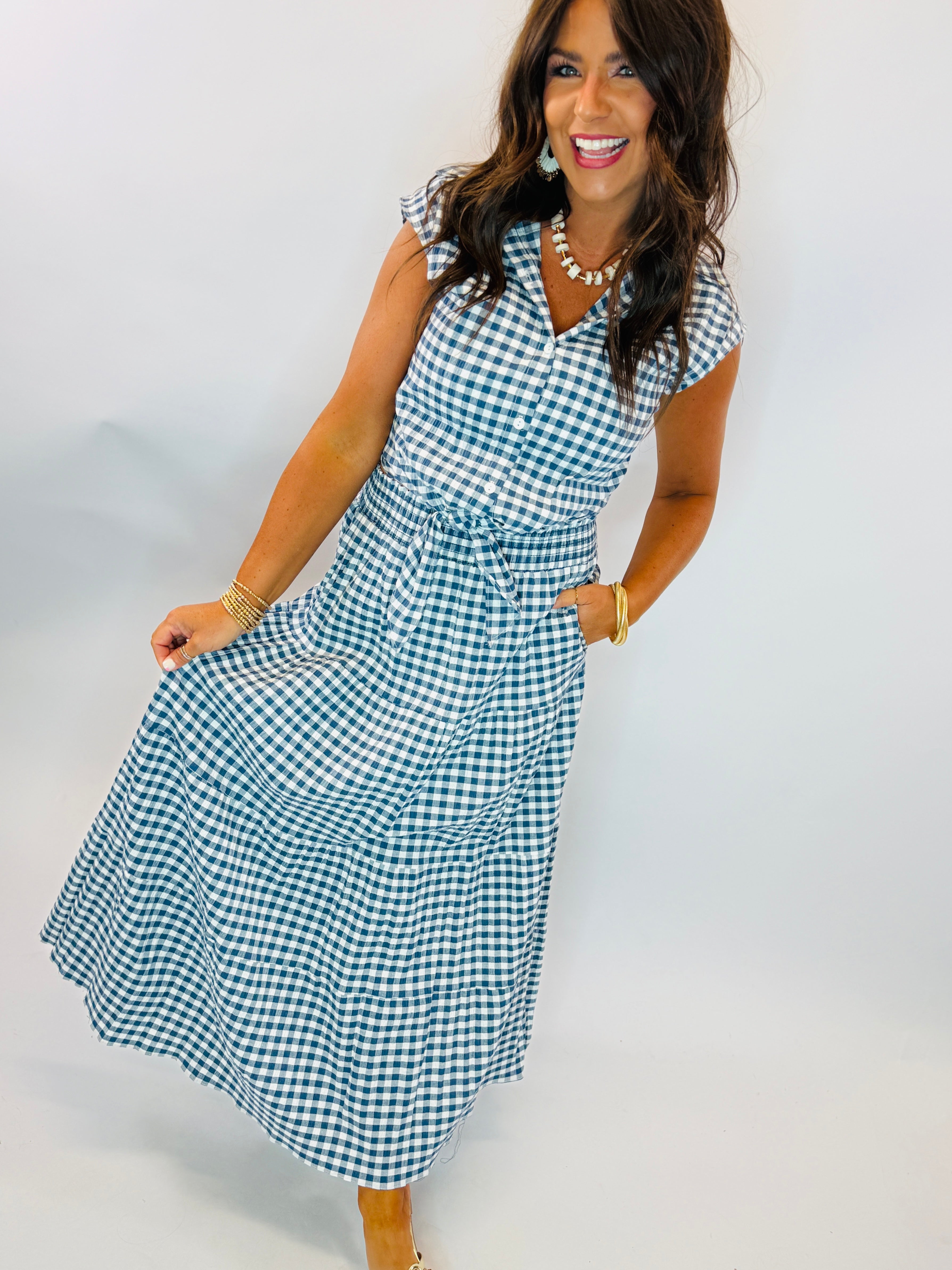 Navy and white gingham maxi skirt with elastic waist and tie, paired with matching top.