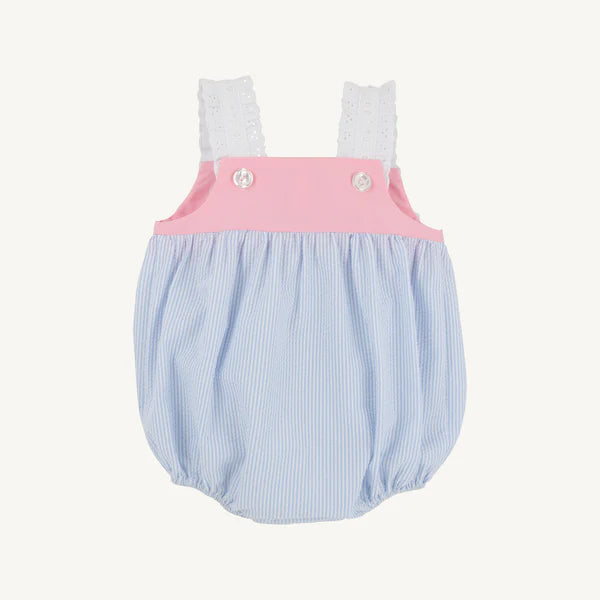 Pink and blue seersucker baby bubble romper with white eyelet shoulder straps and decorative buttons.