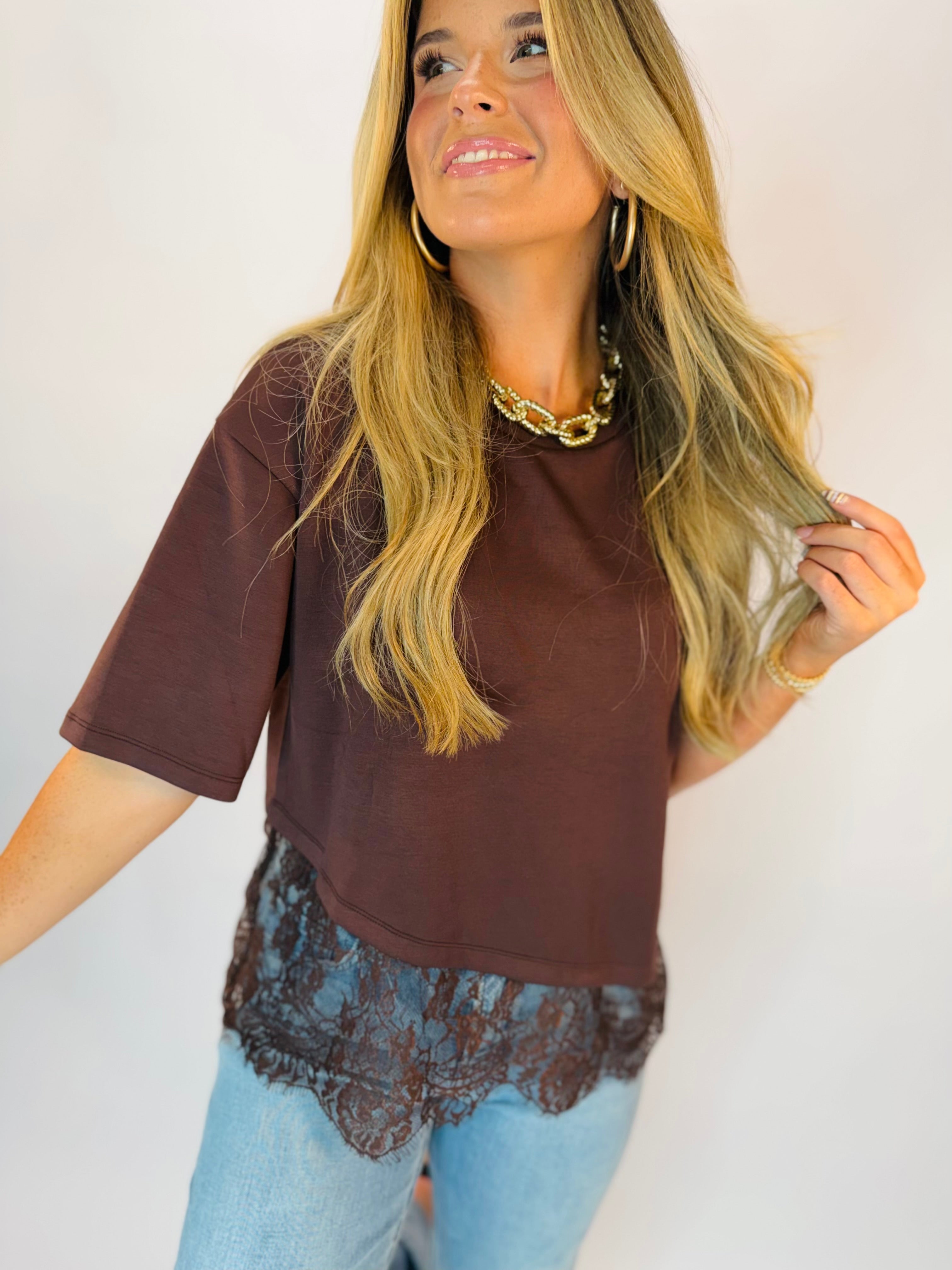 Rachel Top — brown cropped tee with lace hem trim, paired with light wash jeans.