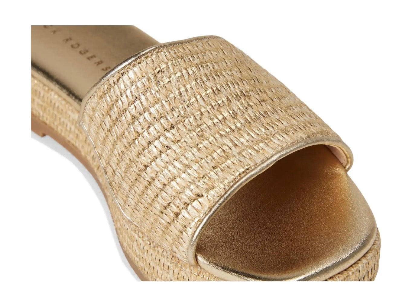 Gold metallic woven raffia slide sandal with wide band strap and espadrille wedge sole.