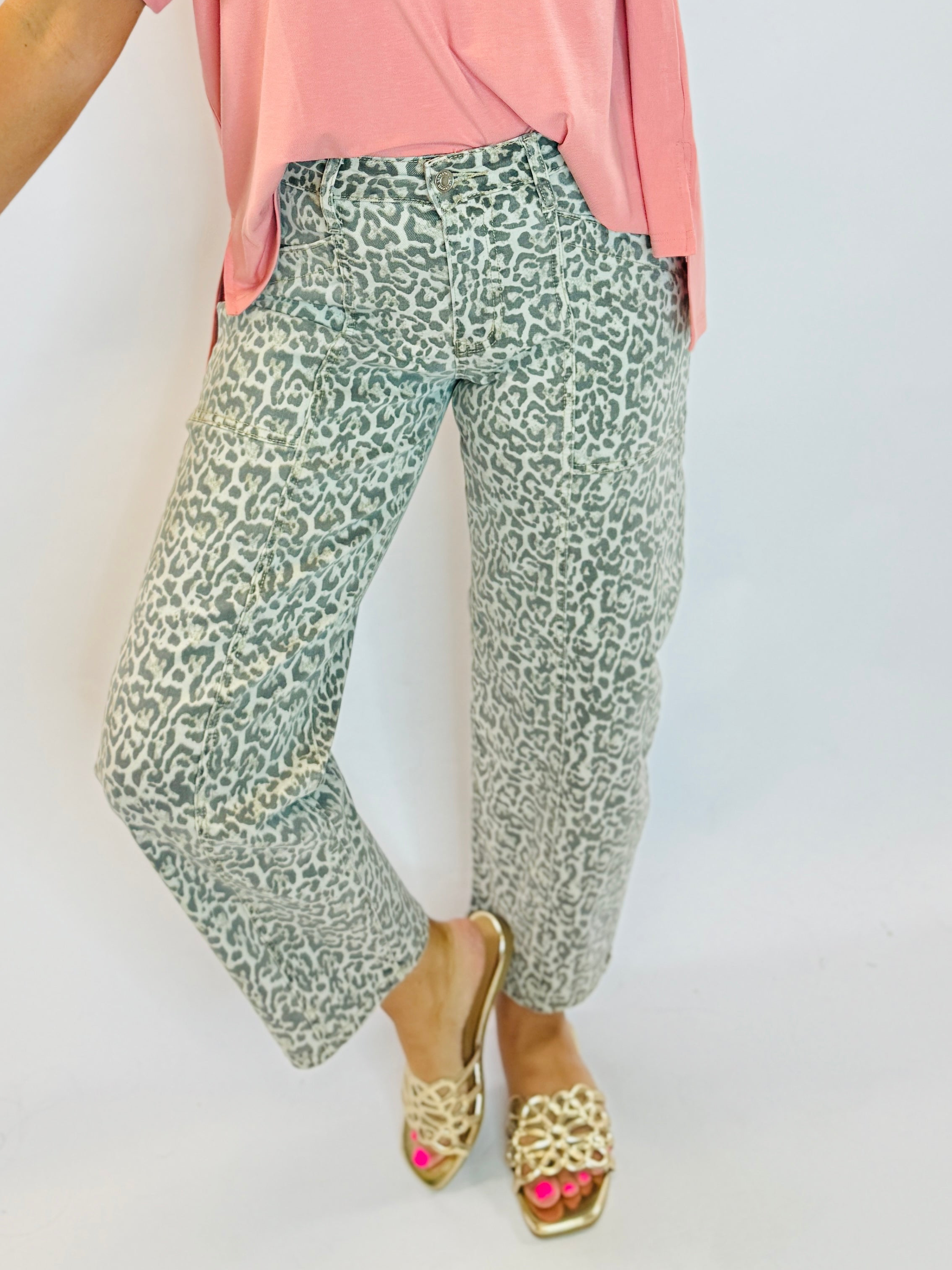 Tatum Barrel Denim jeans in gray leopard print, styled with a pink top and gold sandals.