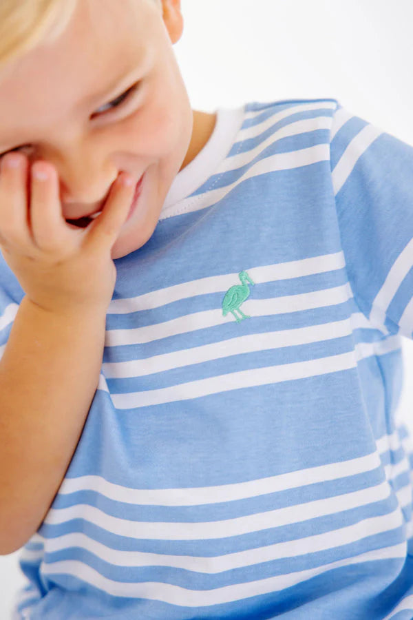 Baby wearing blue and white striped Carter crewneck shirt with small green logo emblem.