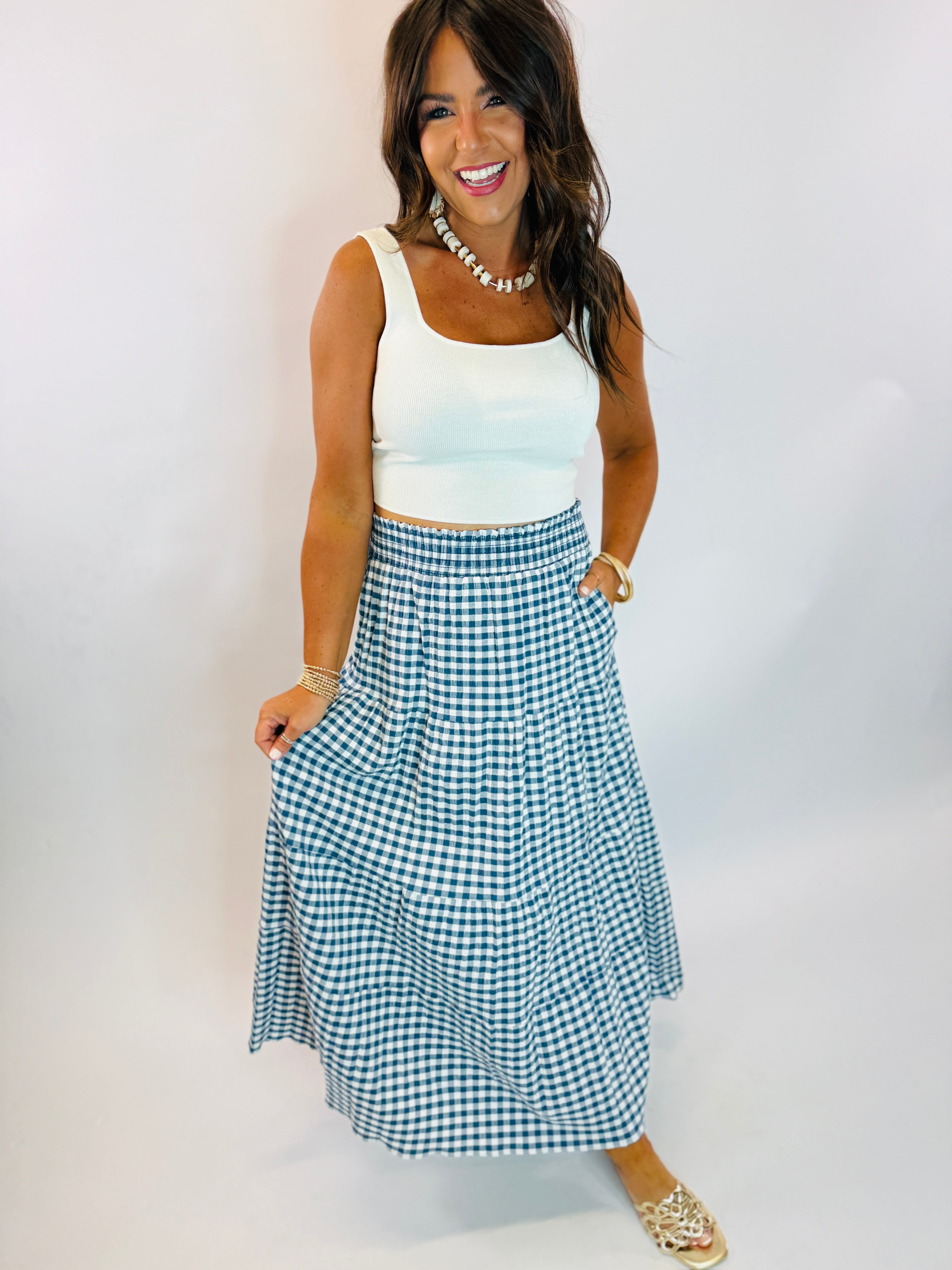 Navy and white gingham tiered maxi skirt with smocked waistband, styled with white crop tank top.