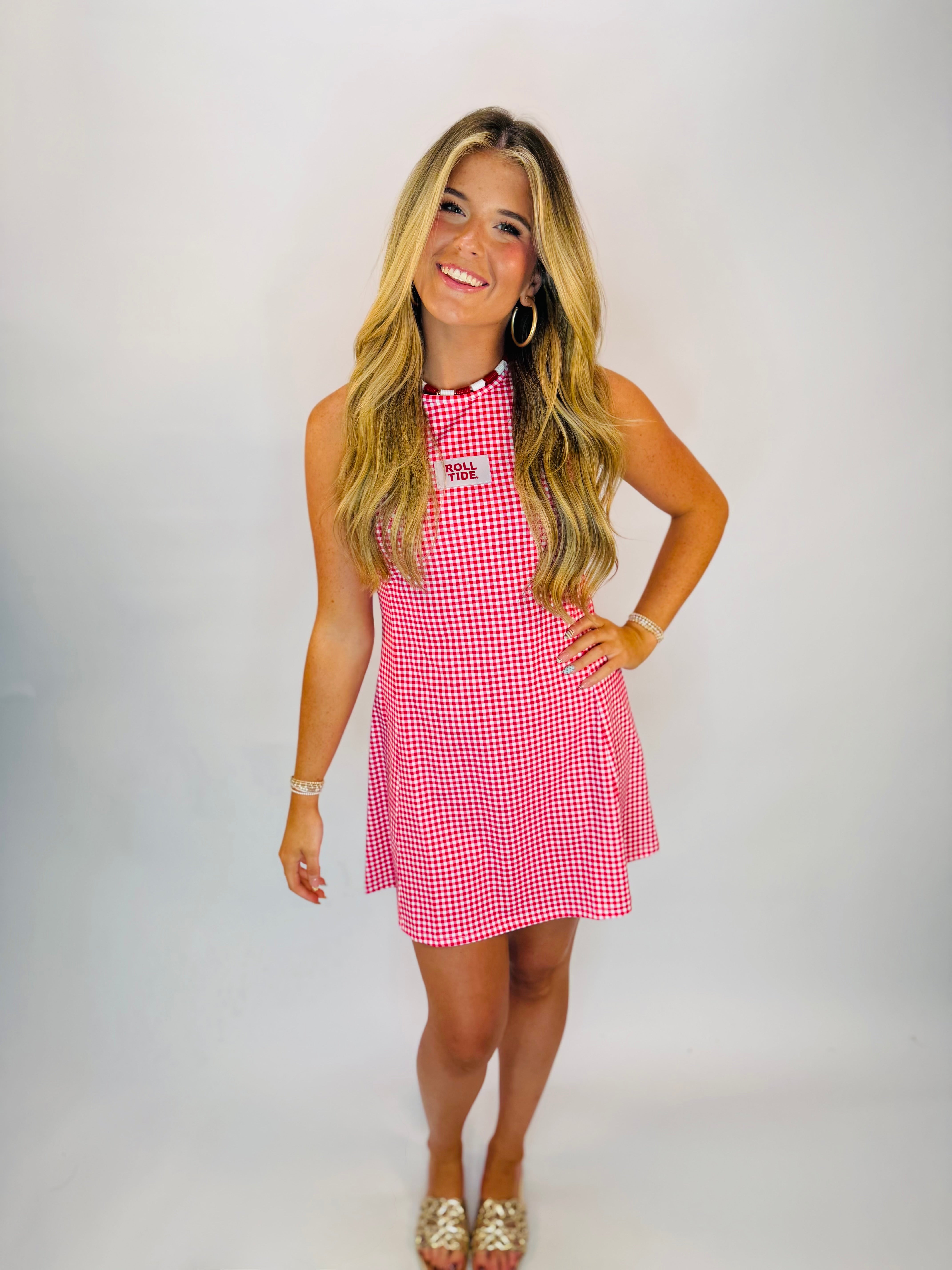 Red and white gingham mini dress with "Roll Tide" patch, pearl neckline detail, sleeveless fit-and-flare style.