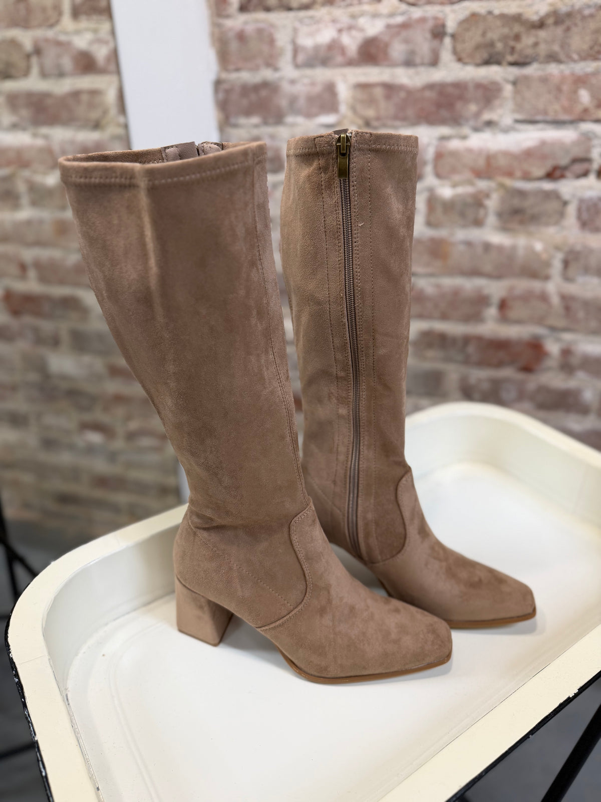 Cybill Boot in taupe suede, knee-high with block heel and side zipper closure.