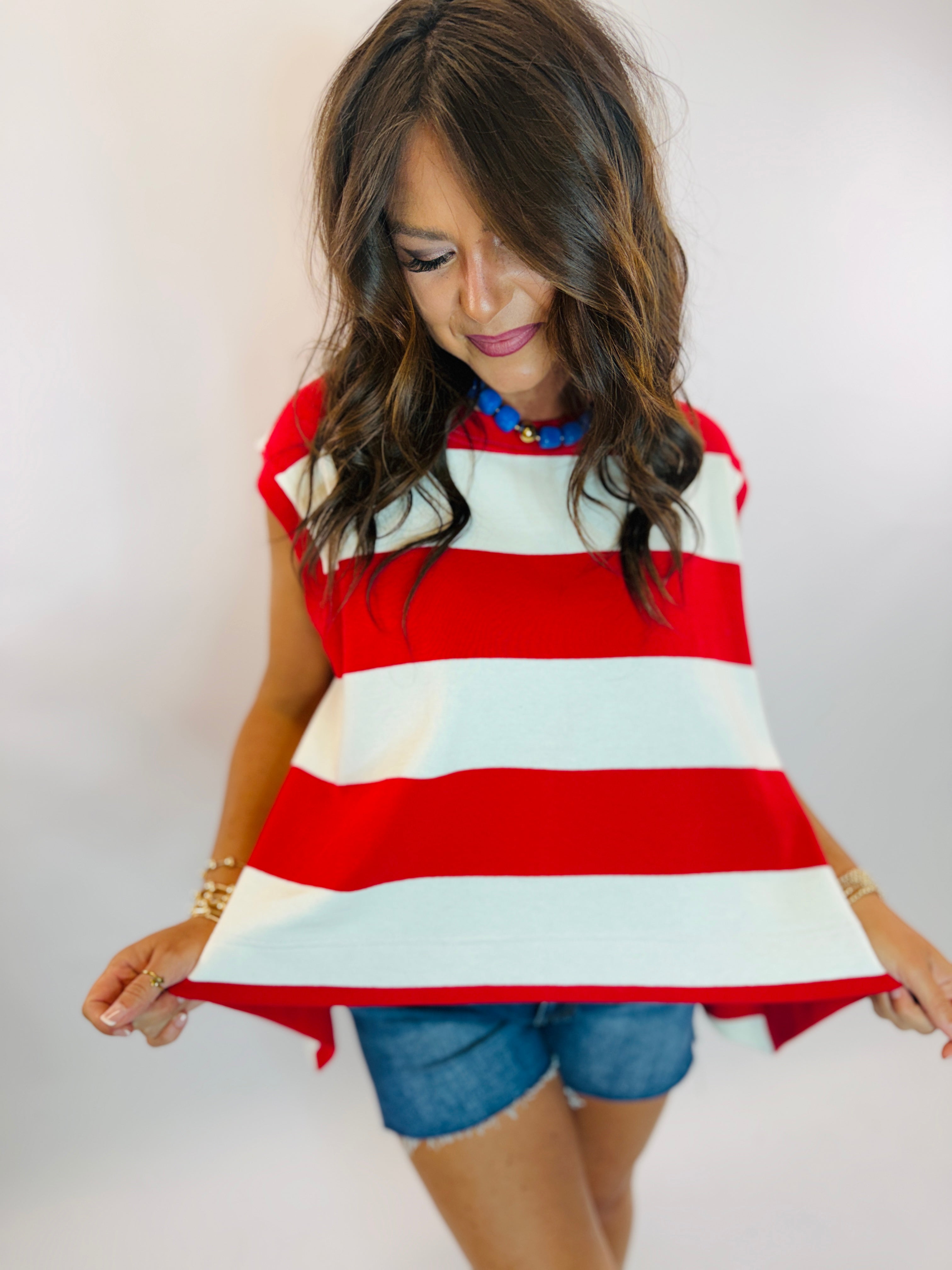 Kennedy Top sweatshirt in bold red and white horizontal stripes with cap sleeves and flowy silhouette.