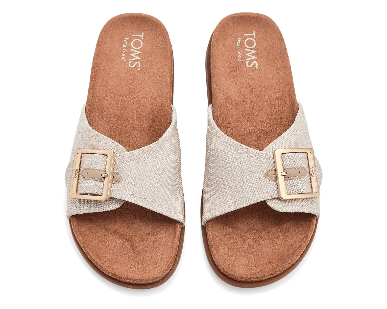 TOMS Marin natural canvas slide sandals with crossed straps, gold buckles, and brown cork footbed.