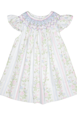 White baby dress with floral rose vine print, smocked bodice, and flutter sleeves.