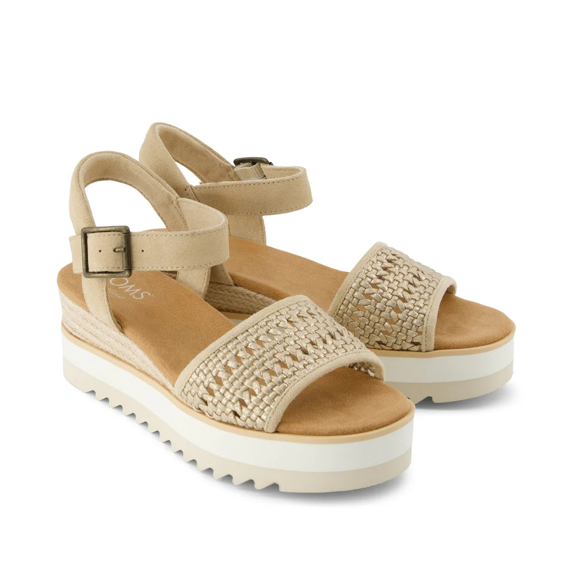 Beige Diana wedge sandals with woven straps, ankle buckles, and white platform soles with ridged texture.