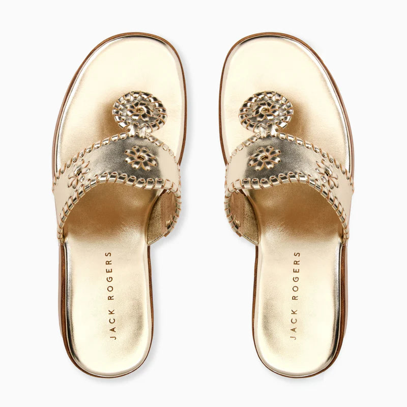 Gold metallic Jack Rogers wedge sandals with signature whipstitched straps and medallion details