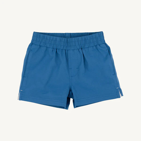 Blue baby shorts with elastic waistband and side pockets on light background