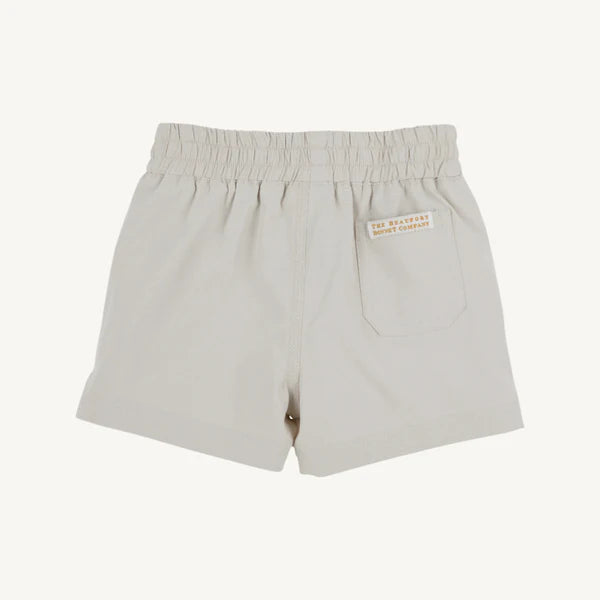 Light gray baby shorts with elastic waistband and back pocket label, shown from behind