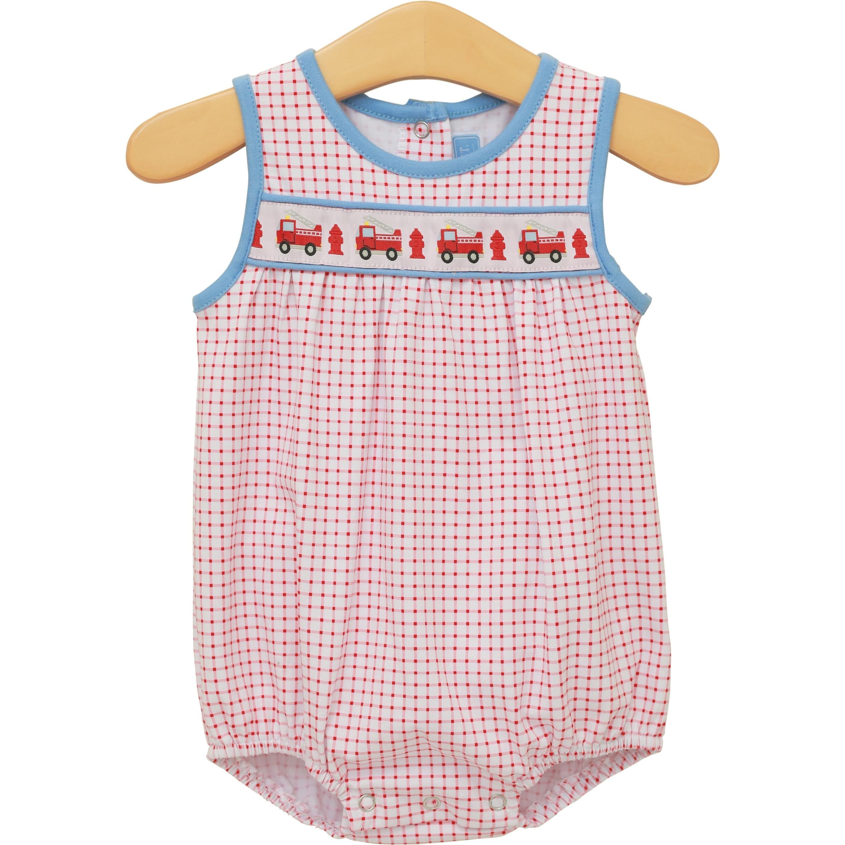 Red gingham baby bubble romper with blue trim and embroidered fire truck design across chest