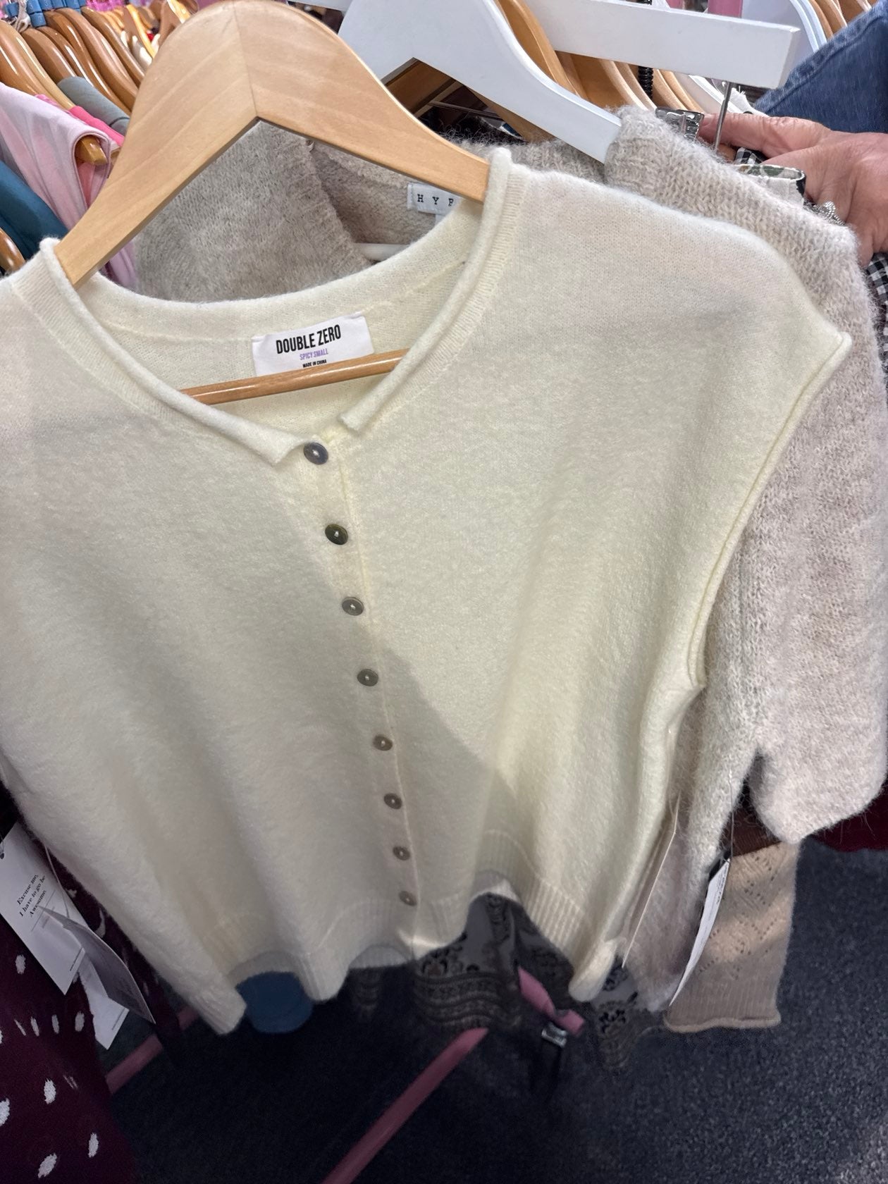 Cream short-sleeve henley sweater with silver snap buttons, Double Zero brand, size Spicy Small.