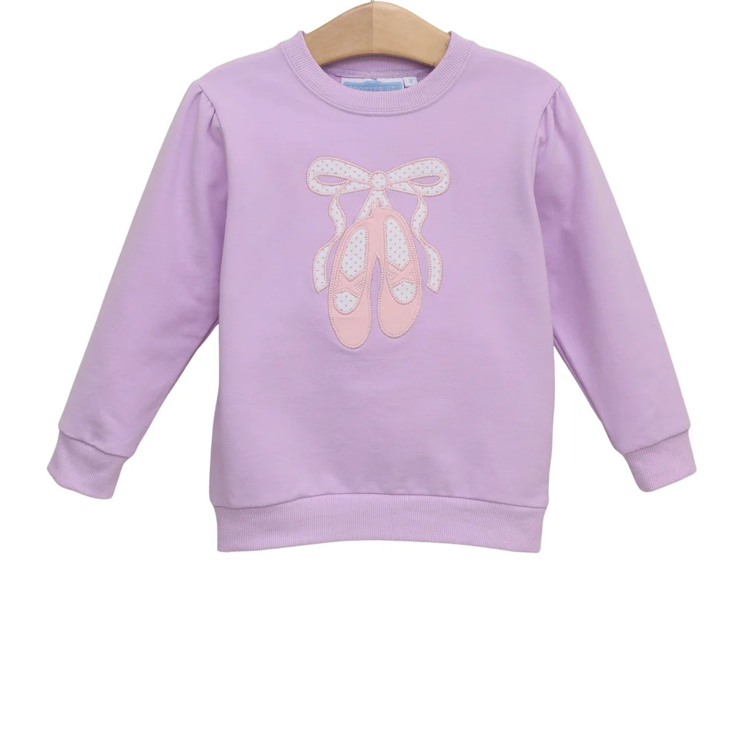Lavender children's French terry pullover sweatshirt with pink appliqué ballet shoes and bow design.