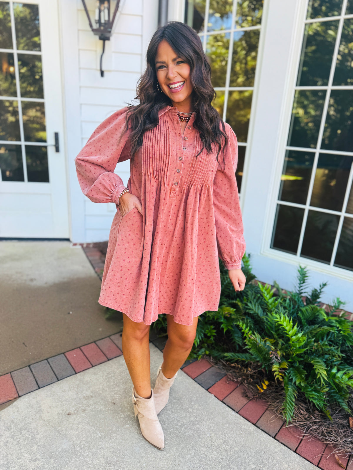 Brooke wearing the Aliyah cinnamon dot pintuck dress with neutral ankle boots.