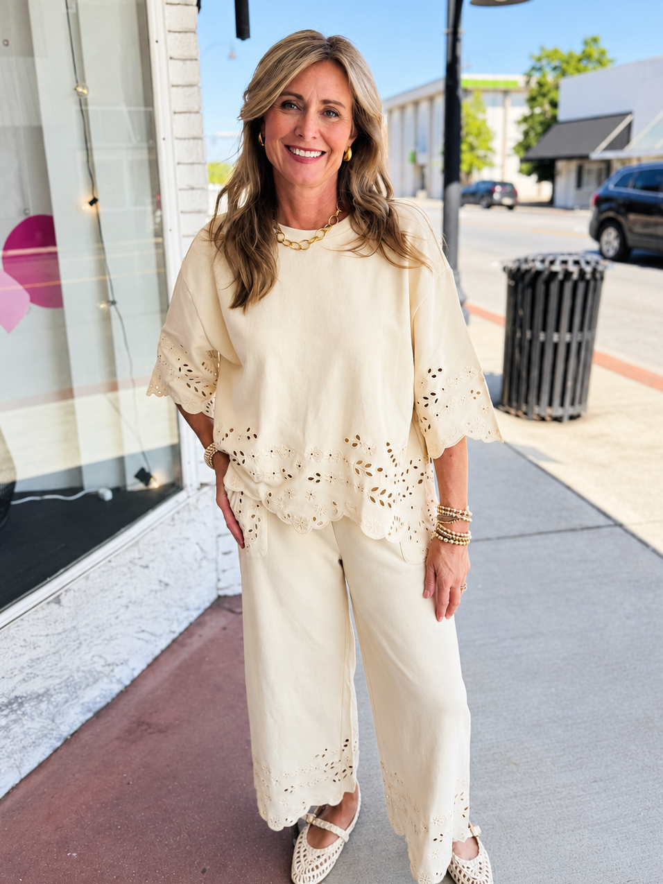 Kelly wearing the Cataleya natural eyelet wide-leg pants with the coordinating scallop-hem top, sold separately.