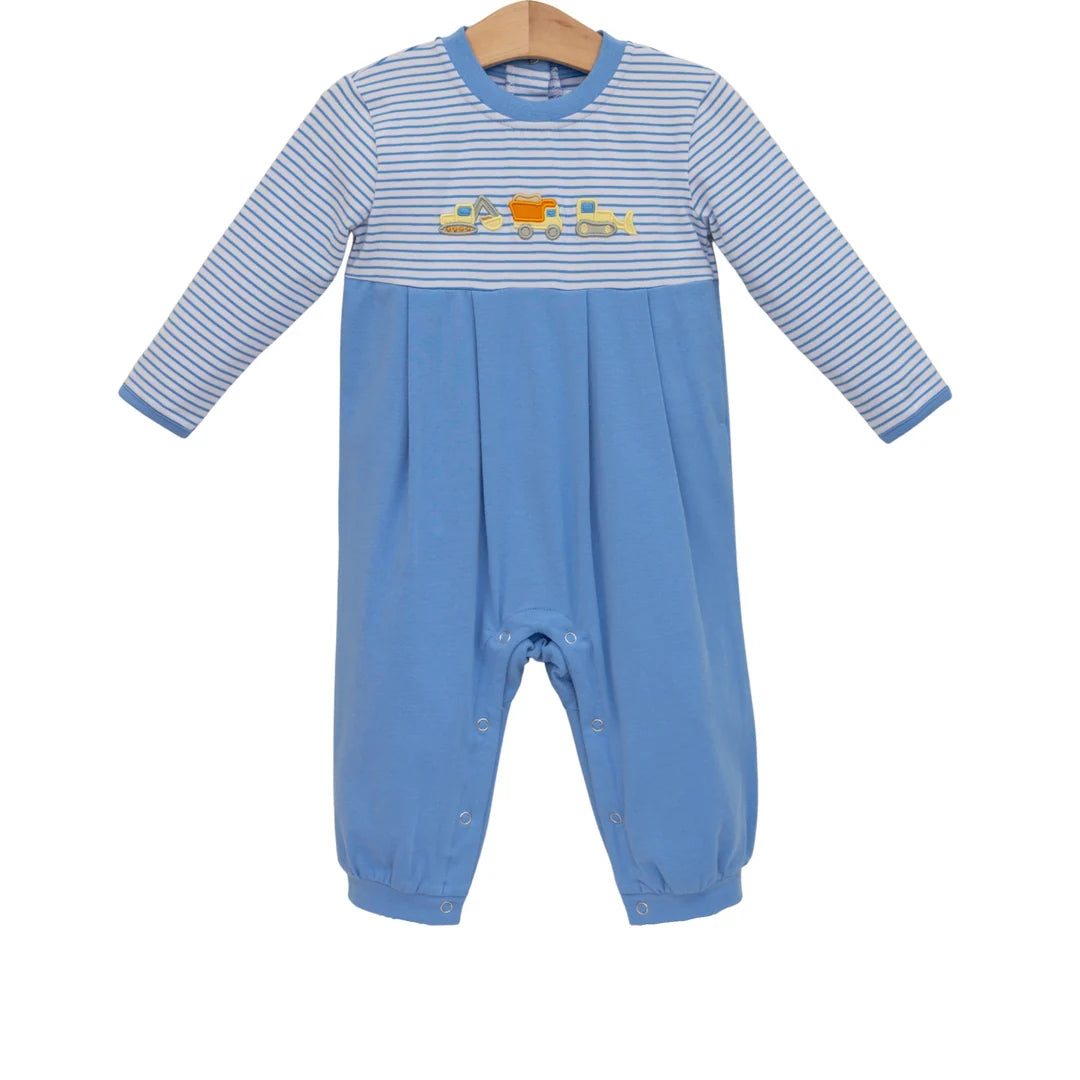 Blue baby romper with striped top, construction truck embroidery, long sleeves, and snap closures.