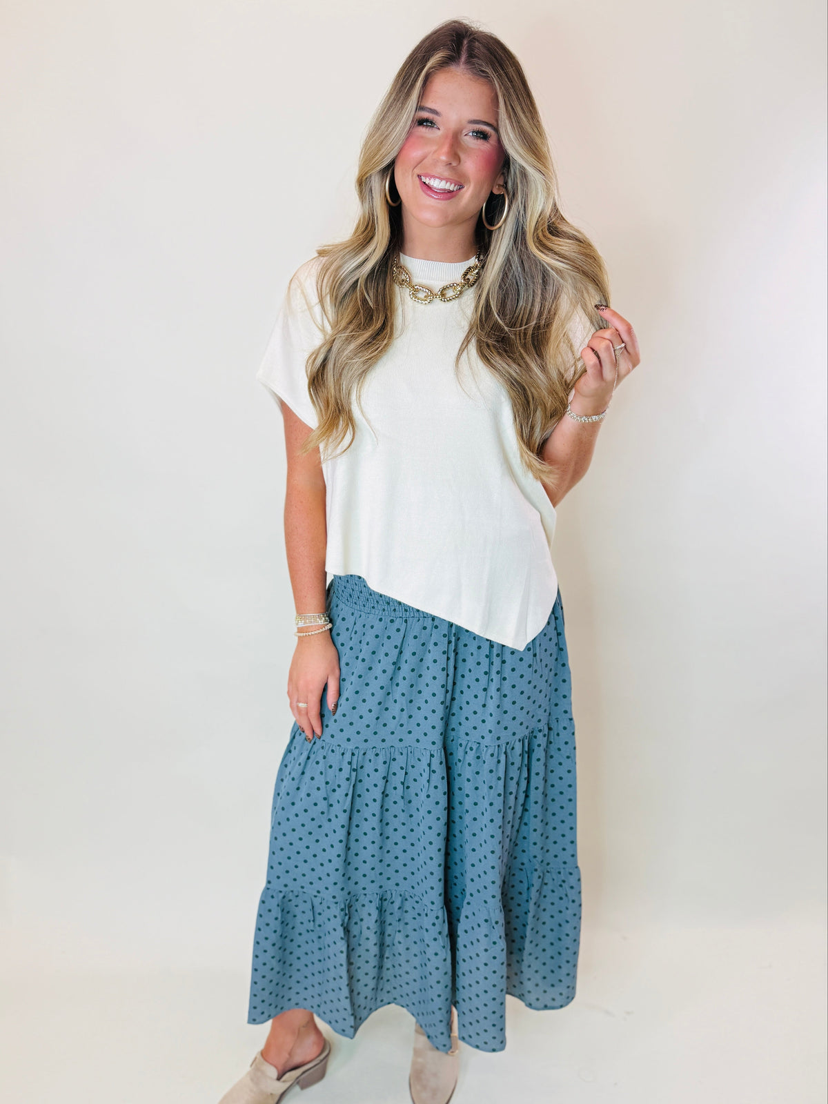 Katie mint green polka dot maxi skirt with a smocked waistband and flowing tiered silhouette.