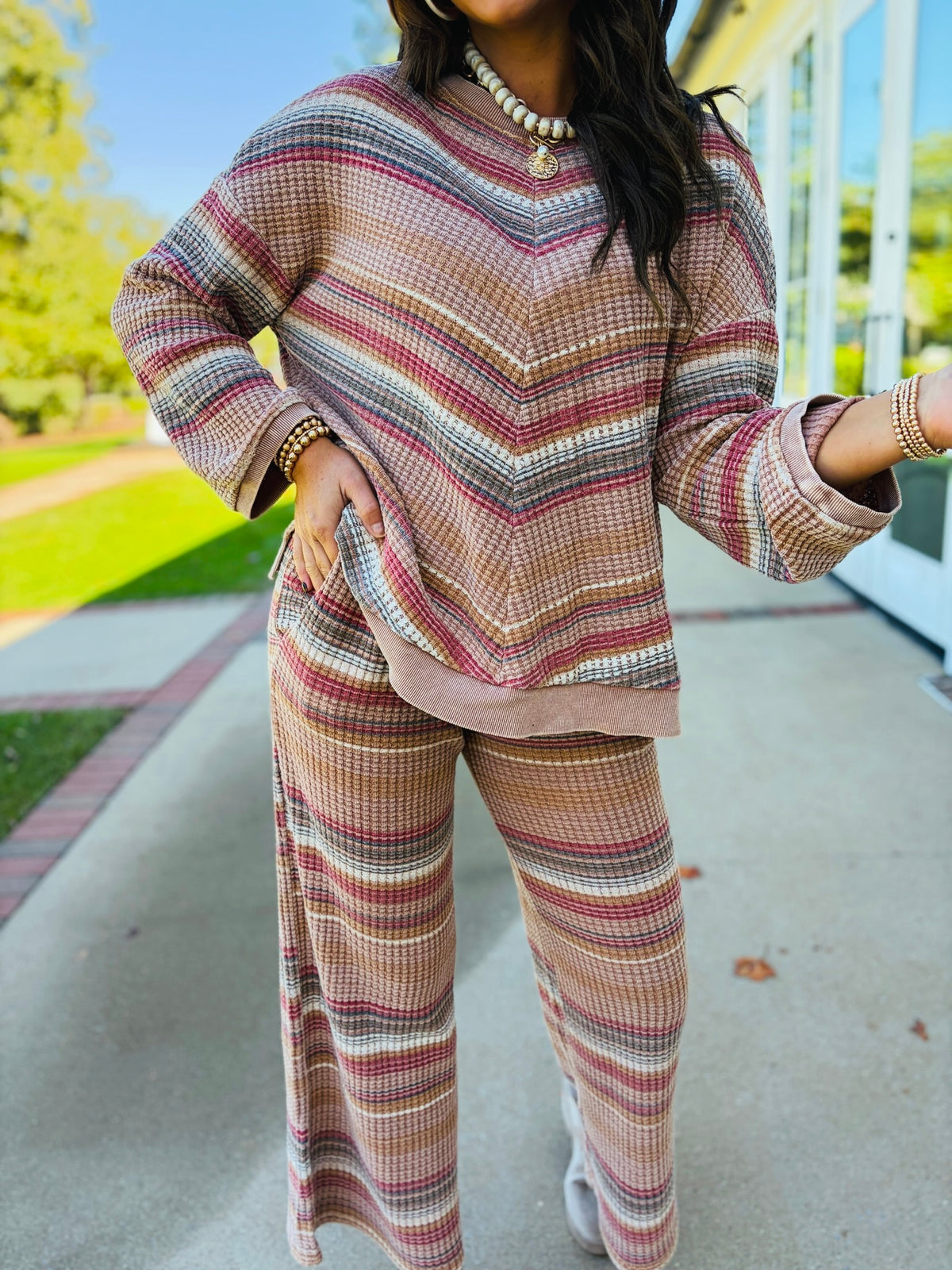 Close-up of the Nadia mocha striped waffle-knit top showing its crew neckline, multicolor stripes and wide sleeves.