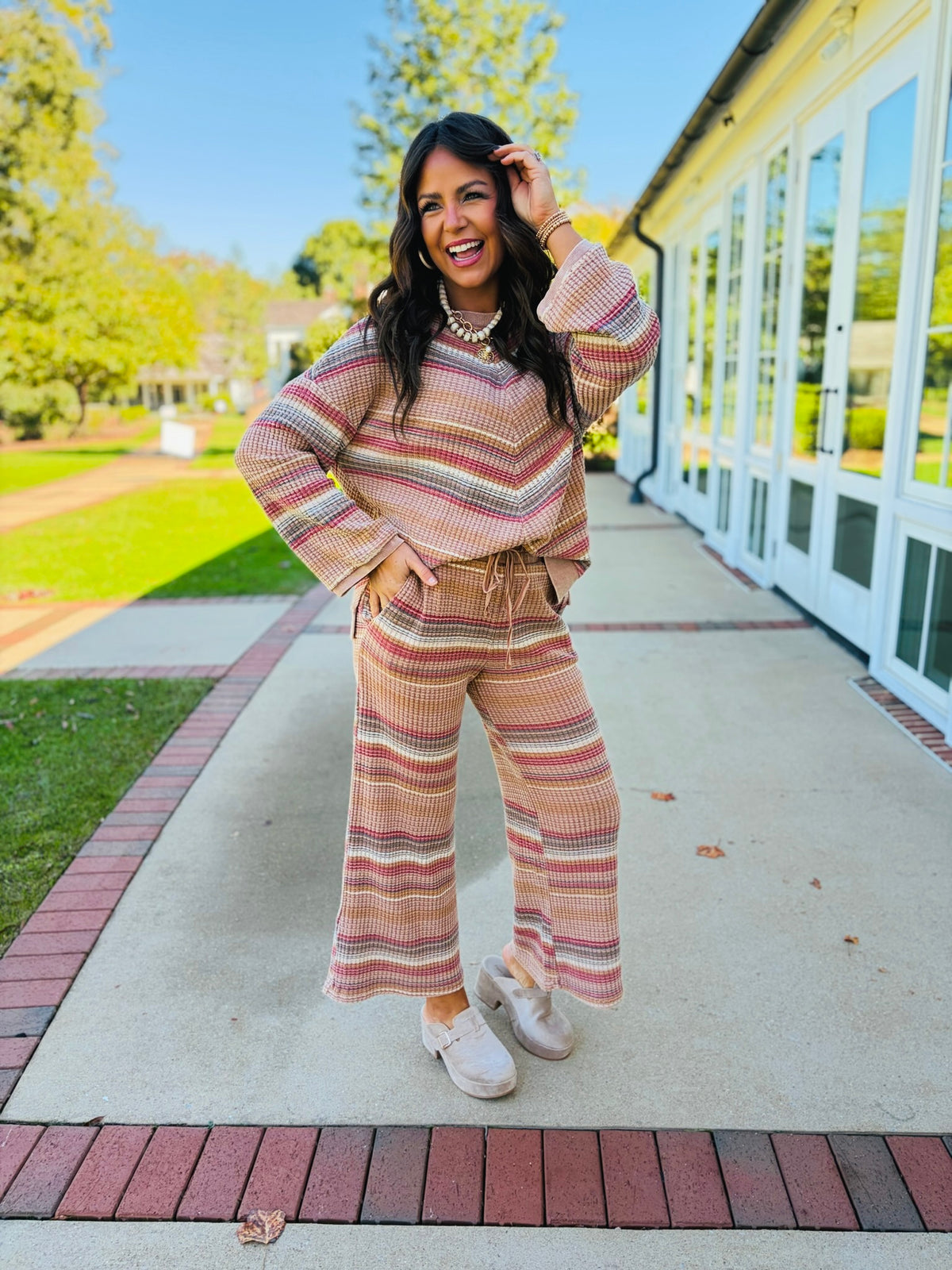 Brooke wearing the Nadia mocha striped waffle-knit top with its coordinating wide-leg pants, sold separately.