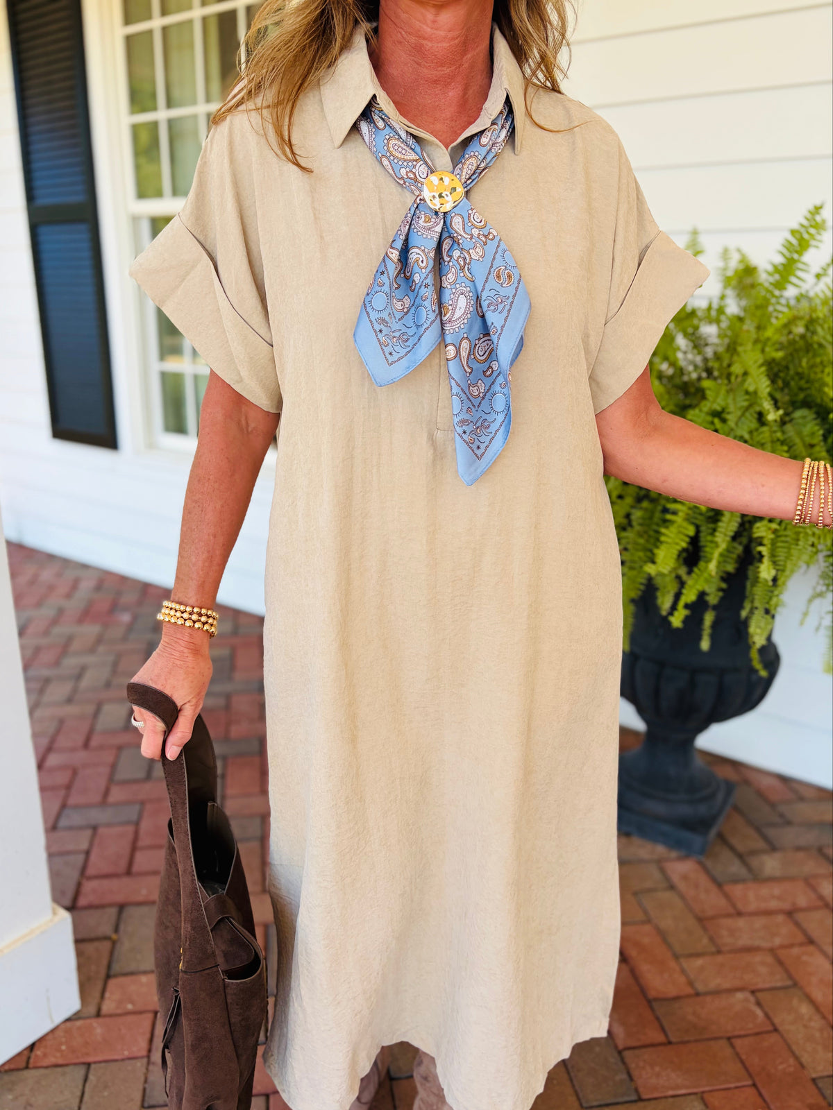 Closer view of the Page light taupe midi dress showing its pointed collar, cuffed short sleeves and relaxed silhouette.