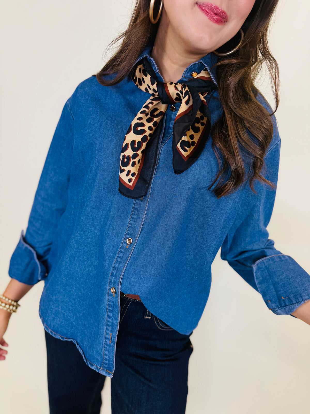 Closer view of the Reese denim shirt showing its collared neckline, button front and softly washed texture.