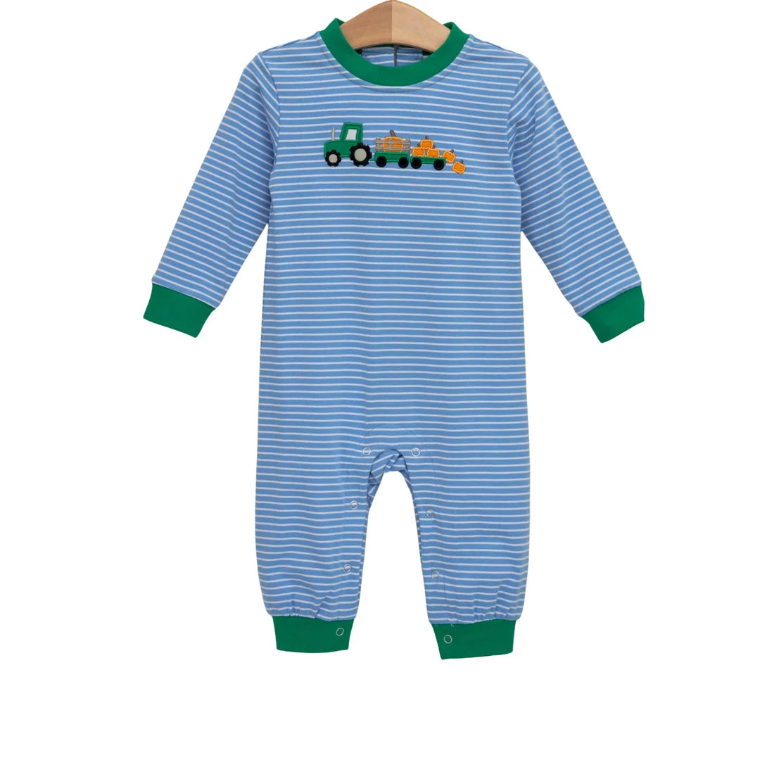 Blue striped long-sleeve baby romper with green trim and embroidered tractor hauling pumpkins appliqué.