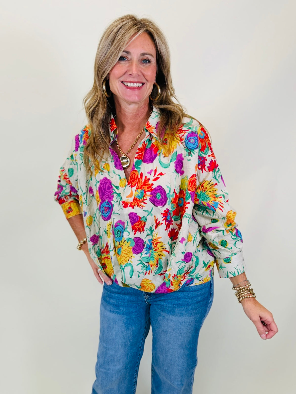 Kelly wearing the Willow ecru multicolor floral button front blouse with blue jeans.
